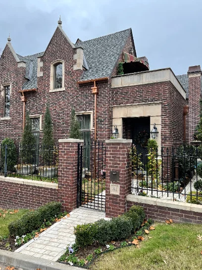 Copper gutters and downspouts on a two-story brick home