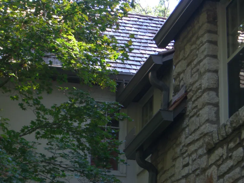 Wilco Guttering completed gutters and downspouts on a stone home in Tulsa